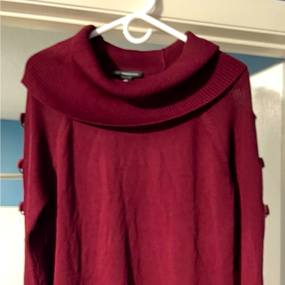 Long sweater dress with unique sleeves.